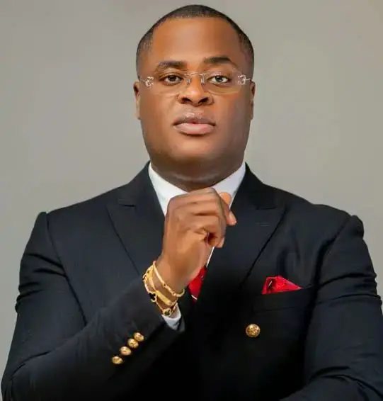 Portrait of Dr Paddy Iyamu in a black double-breasted suit