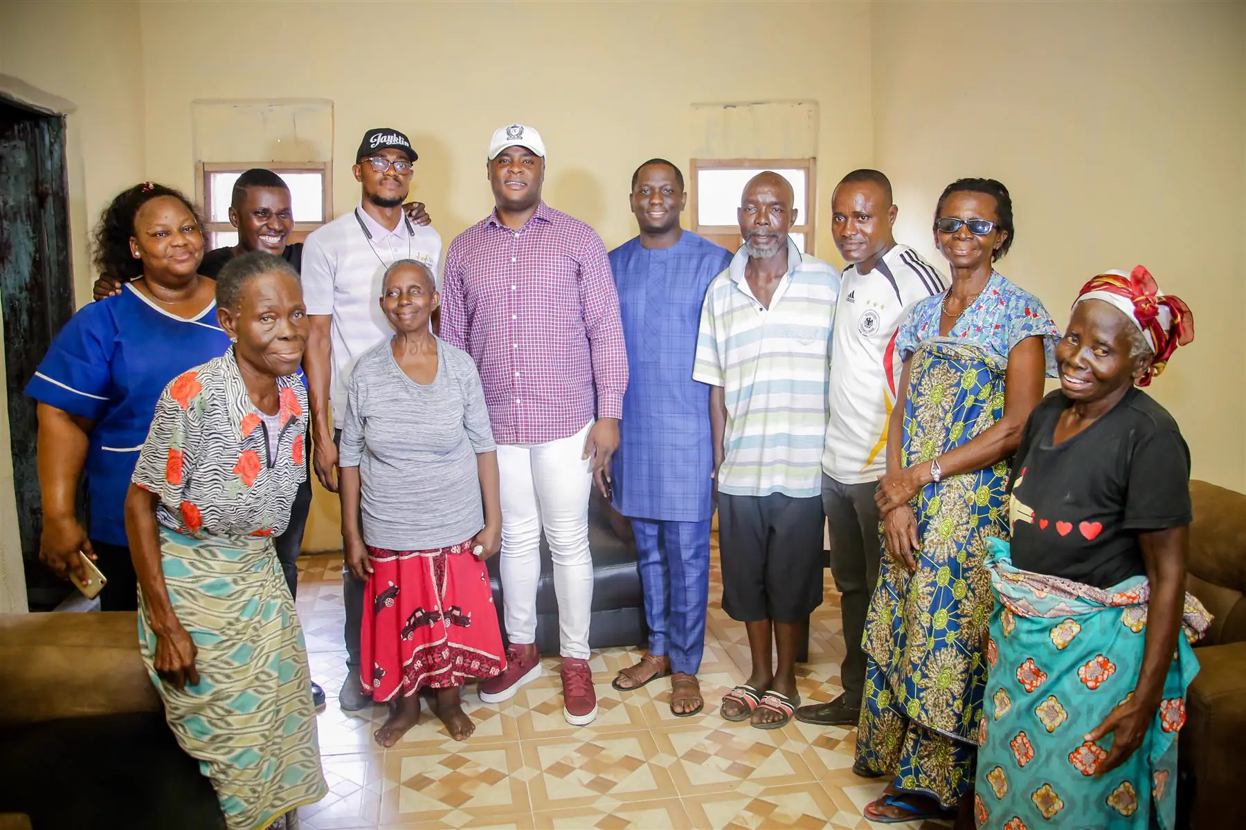 Dr Paddy Iyamu in a group photograph with elderly residents after a community visit