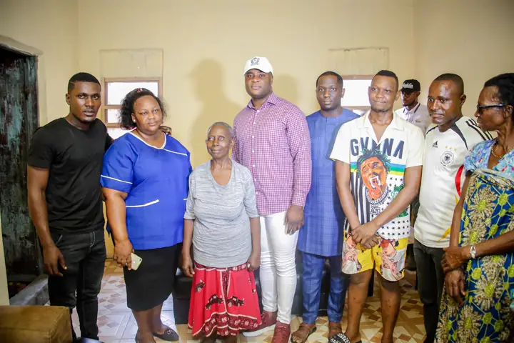 A resident posing with the outreach team