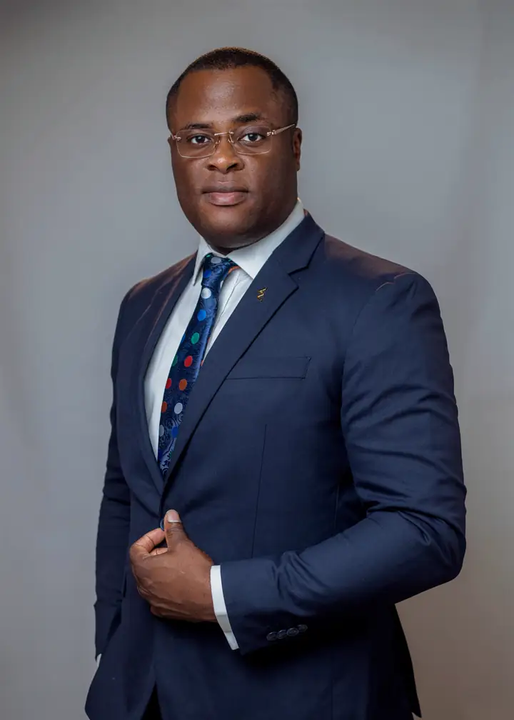 Portrait of Dr Paddy Iyamu in a navy suit