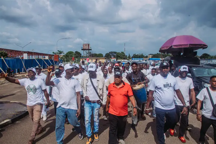 Members of the movement arriving on foot