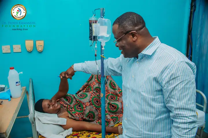 Greeting a patient connected to a drip